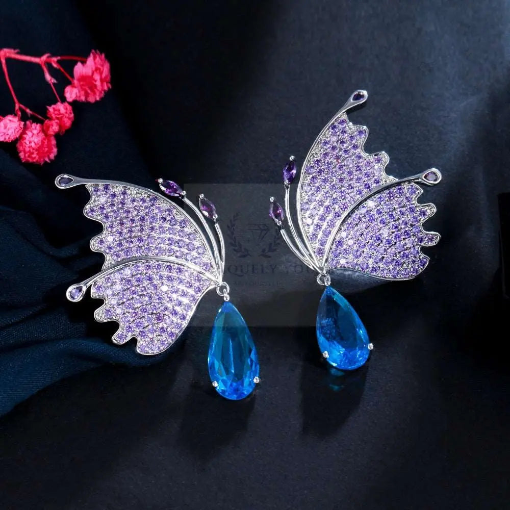 Pendientes de ala de mariposa púrpura/azul